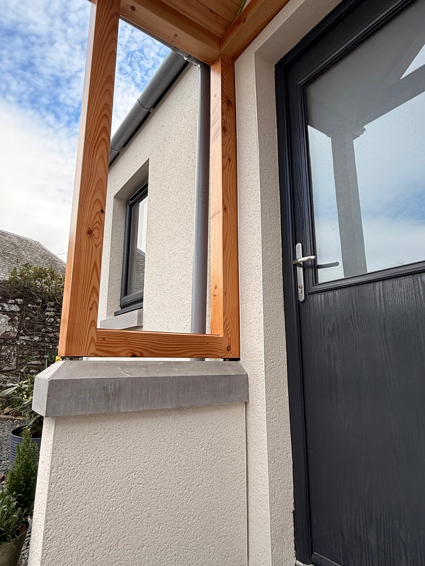 Smooth render around porch and door